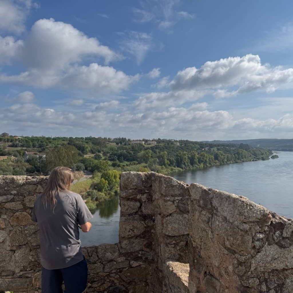 Reader looking out over the River Tagus from the battlements of Almourol Castle