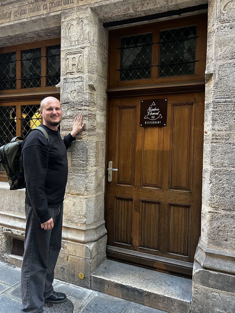 Luke Richardson at the house of the alchemist Nicolas Flamel, built in 1407, in Paris